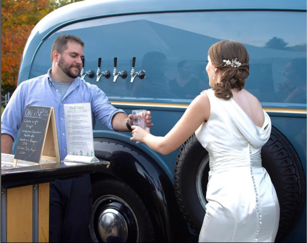Bartender handing the bride a beer he poured from the blue tap truck behind them